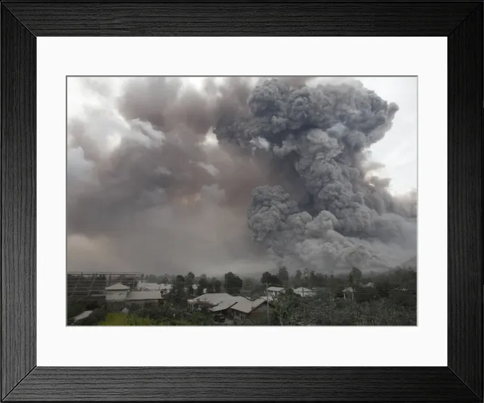 Framed Print : An ash cloud from a Mount Sinabung eruption is seen from Kuta Tengah village in Karo Framed Print : An ash cloud from a Mount Sinabung eruption is seen from Kuta Tengah village in Karo