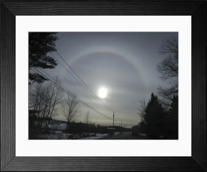 Framed Print : Truck drives down a highway as a sun dog appears in the sky as seen from Fort Ann in