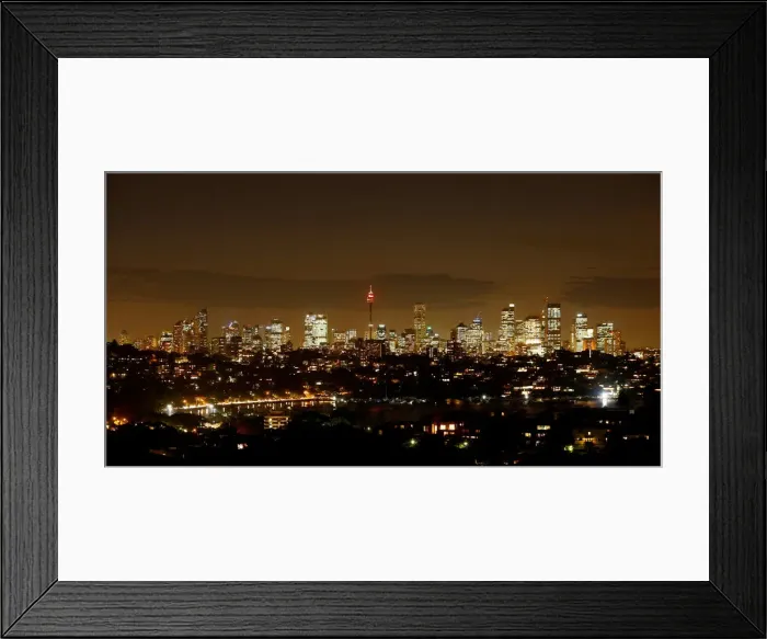 Framed Print : Sydneys central business district lights up after sunset as Australias largest city Framed Print : Sydneys central business district lights up after sunset as Australias largest city