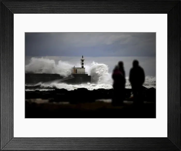 Framed Print : People look at huge waves crashing on the San Esteban de Pravia seafront Framed Print : People look at huge waves crashing on the San Esteban de Pravia seafront