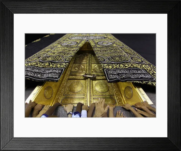 Framed Print : Muslims touch the holy Kaaba at the Grand Mosque during the holy fasting month of Ramadan Framed Print : Muslims touch the holy Kaaba at the Grand Mosque during the holy fasting month of Ramadan