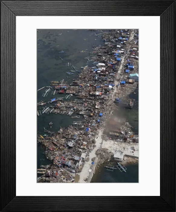 Framed Print : An aerial view of the devastation of super Typhoon Haiyan as it battered a town in Samar Framed Print : An aerial view of the devastation of super Typhoon Haiyan as it battered a town in Samar