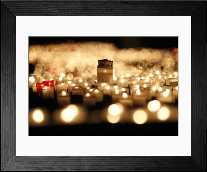 Framed Print : Candles are seen in front of the Frauenkirche in Dresden to commemorate the 67th