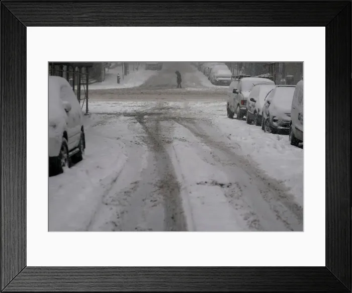 Framed Print : Pedestrian crosses 41st St. during Storm Grayson in New York City Framed Print : Pedestrian crosses 41st St. during Storm Grayson in New York City