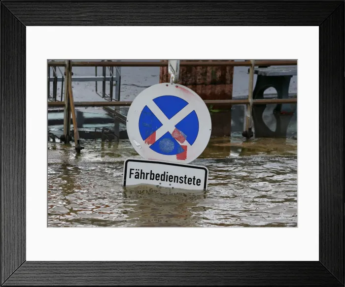 Framed Print : A traffic sign is flooded by the river Rhine, in Linz