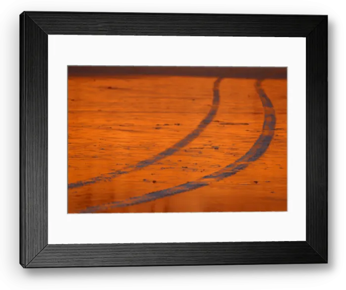 Framed Print : A lifeguard truck leaves traces in the sand at low tide in Solana Beach, California