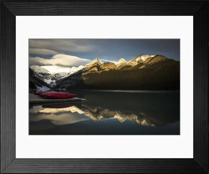 Framed Print : Canoes are seen on a dock on Lake Louise at Banff National Park Framed Print : Canoes are seen on a dock on Lake Louise at Banff National Park