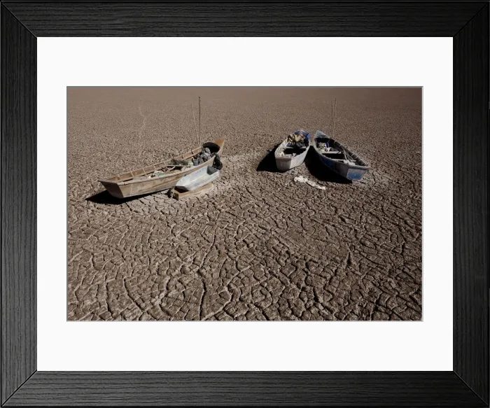Framed Print : Boats of fishermen are seen on the dried Poopo lakebed in the Oruro Department Framed Print : Boats of fishermen are seen on the dried Poopo lakebed in the Oruro Department
