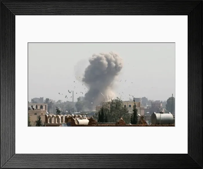 Framed Print : Smoke and debris rise from the site of a Saudi-led air strike in Sanaa Framed Print : Smoke and debris rise from the site of a Saudi-led air strike in Sanaa