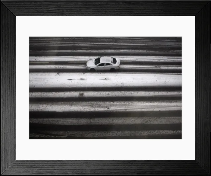 Framed Print : A car drives in a heavy snowfall in central Budapest Framed Print : A car drives in a heavy snowfall in central Budapest