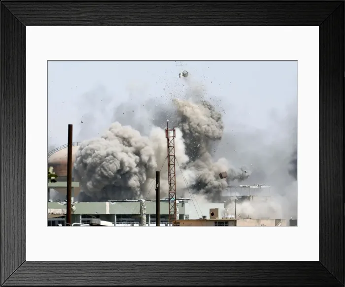 Framed Print : Debris fly as smoke rises after an artillery attack to the Islamic State militants Framed Print : Debris fly as smoke rises after an artillery attack to the Islamic State militants
