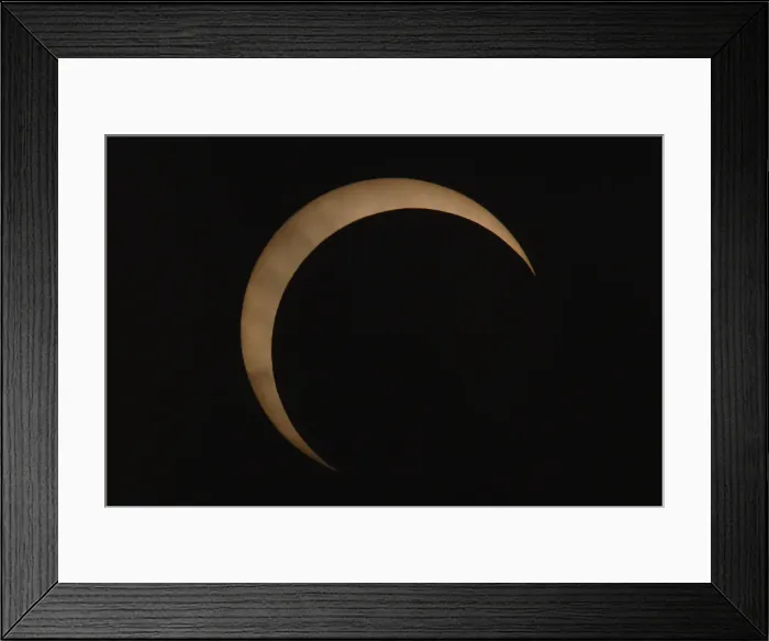 Framed Print : An eclipse is seen in at the Bund along the Huangpu River in Shanghai