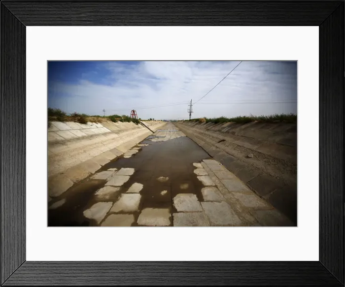 Framed Print : An irrigation canal is seen near the dried up Shiyang river on the outskirts of Minqin Framed Print : An irrigation canal is seen near the dried up Shiyang river on the outskirts of Minqin