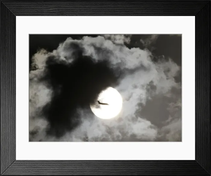 Framed Print : A passenger aircraft is silhouetted against the rising sun after taking off from New Framed Print : A passenger aircraft is silhouetted against the rising sun after taking off from New