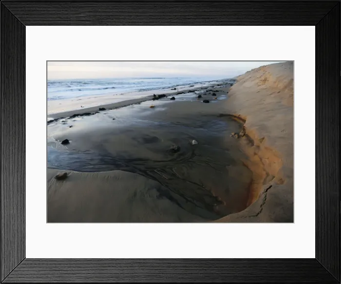 Framed Print : A view shows a damaged sand dune due to the erosion on the Atlantic Ocean coastline in Framed Print : A view shows a damaged sand dune due to the erosion on the Atlantic Ocean coastline in