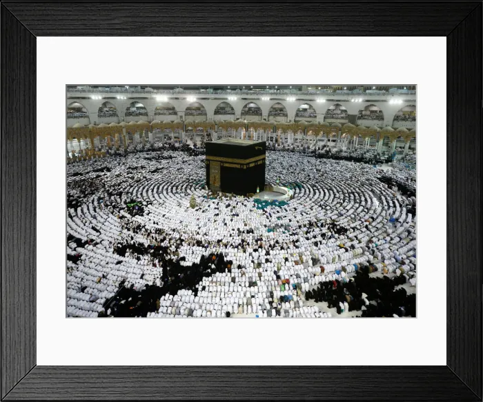Framed Print : Muslims pray and gather around the holy Kaaba at the Grand Mosque during the holy fasting Framed Print : Muslims pray and gather around the holy Kaaba at the Grand Mosque during the holy fasting