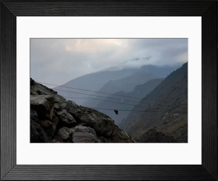 Framed Print : Villagers are seen crossing the river with a zipline in Lazimi village in Nujiang Lisu Framed Print : Villagers are seen crossing the river with a zipline in Lazimi village in Nujiang Lisu