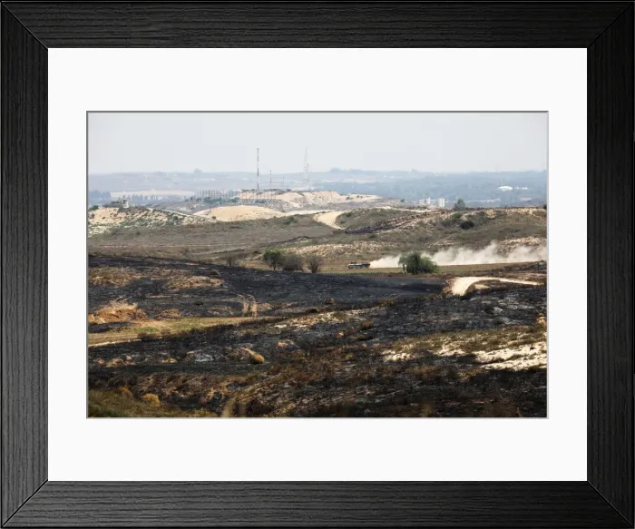 Framed Print : An Israeli armoured personnel carrier (APC) drives on the Israeli side of the border Framed Print : An Israeli armoured personnel carrier (APC) drives on the Israeli side of the border
