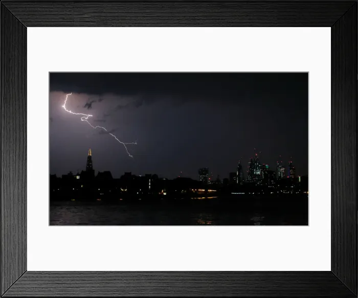 Framed Print : General view as lightning strikes over the city of London, Britain Framed Print : General view as lightning strikes over the city of London, Britain