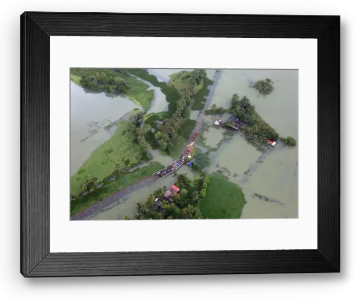 Framed Print : An aerial view shows partially submerged road at a flooded area in the southern state of Framed Print : An aerial view shows partially submerged road at a flooded area in the southern state of