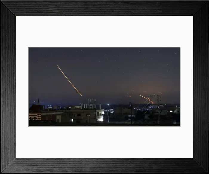 Framed Print : Missile fire is seen over Daraa