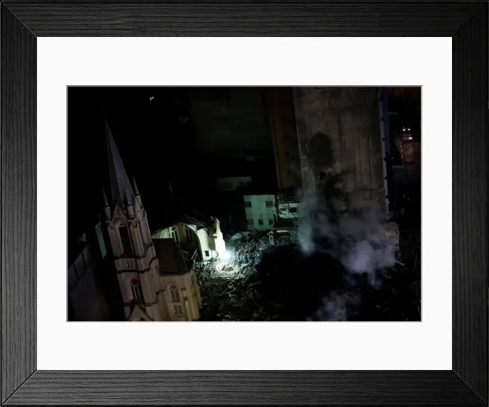 Framed Print : Firefighters work on a church and a building that caught fire