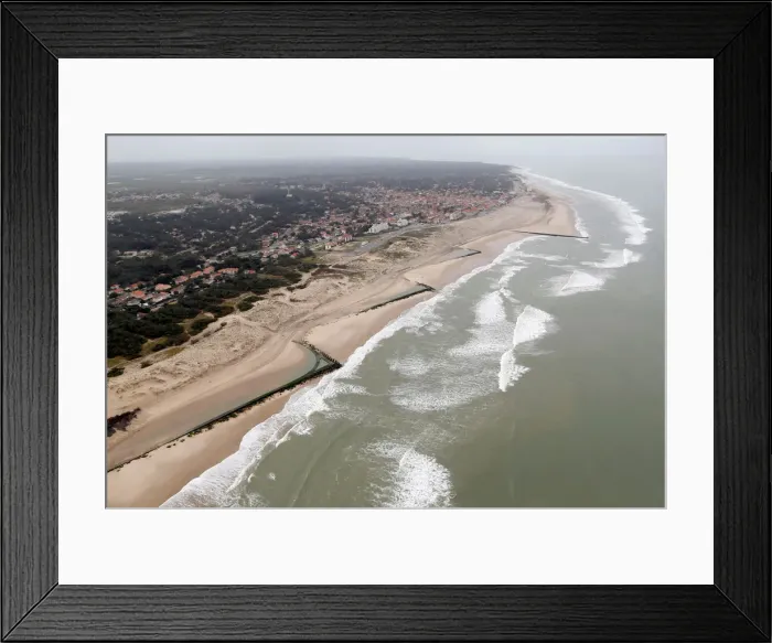 Framed Print : An aerial view shows sea walls on the beach that protect sand dunes from erosion along