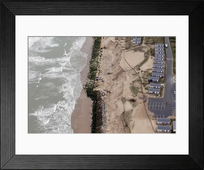 Framed Print : An aerial view shows sea walls on the beach that protect camping Framed Print : An aerial view shows sea walls on the beach that protect camping