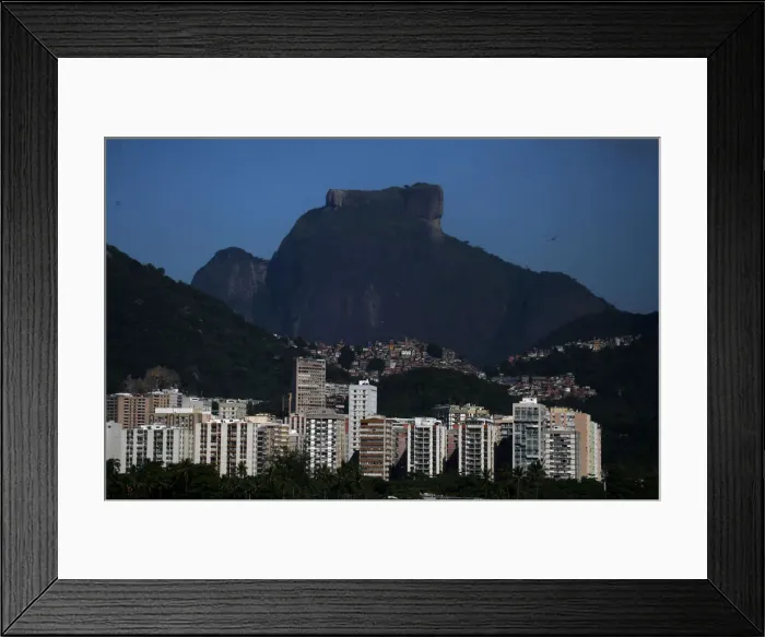 Framed Print : The Rocinha slum is see behind buildings in Rio de Janeiro Framed Print : The Rocinha slum is see behind buildings in Rio de Janeiro