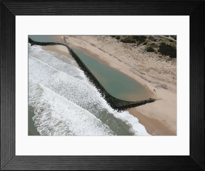 Framed Print : An aerial view shows sea walls on the beach that protect sand dunes from erosion along Framed Print : An aerial view shows sea walls on the beach that protect sand dunes from erosion along