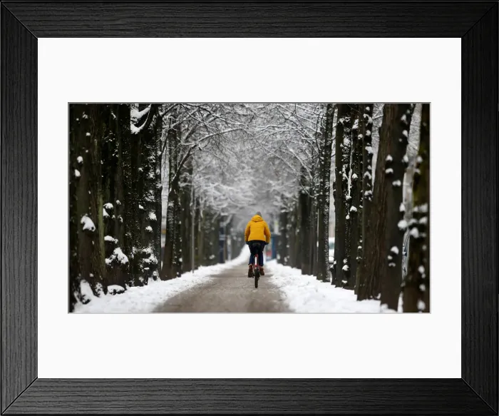Framed Print : A bicyclist is seen in the snow covered Munich Framed Print : A bicyclist is seen in the snow covered Munich