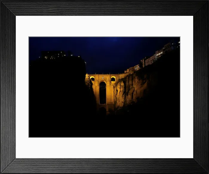 Framed Print : The Puente Nuevo (New Bridge) is seen before the Earth Hour in Ronda