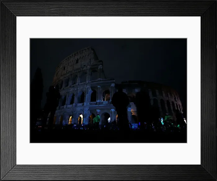 Framed Print : The ancient Colosseum is seen after the lights were switched off for Earth Hour in Rome