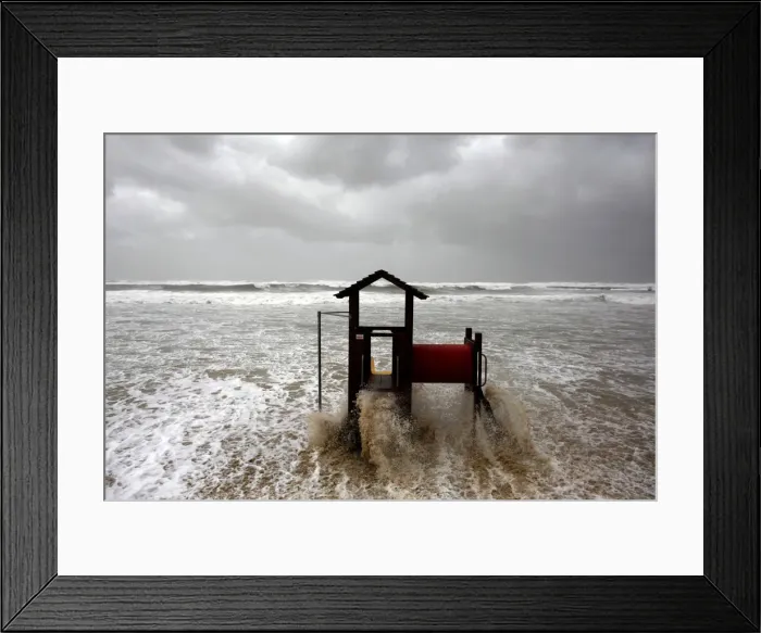 Framed Print : Waves break on a slide on the shore of the Mediterranean in Tel Aviv