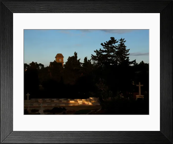 Framed Print : The Saint Patricks Barracks clock tower is seen from the Pembroke Military Cemetery in Framed Print : The Saint Patricks Barracks clock tower is seen from the Pembroke Military Cemetery in