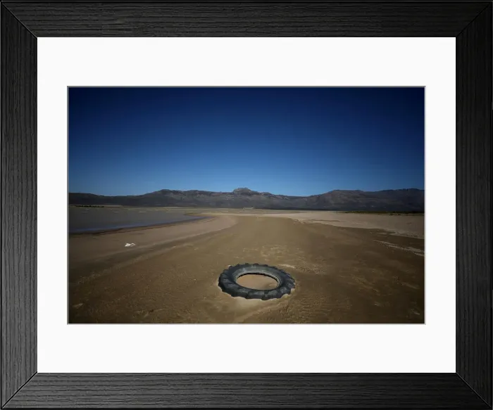 Framed Print : Debris is seen as water levels fall to about 24 percent full at Voelvlei Dam Framed Print : Debris is seen as water levels fall to about 24 percent full at Voelvlei Dam