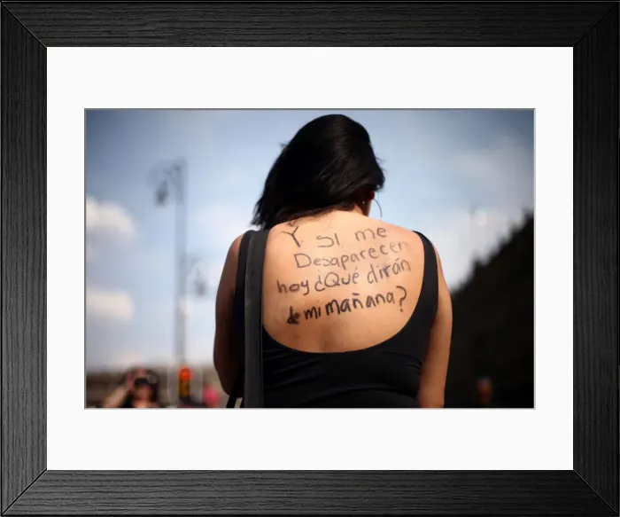 Framed Print : A woman takes part in a demonstration demanding justice for the female victims of Framed Print : A woman takes part in a demonstration demanding justice for the female victims of