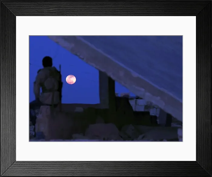 Framed Print : A fighter from Free Syrian Army is seen watching a full moon rises in Daraa Framed Print : A fighter from Free Syrian Army is seen watching a full moon rises in Daraa