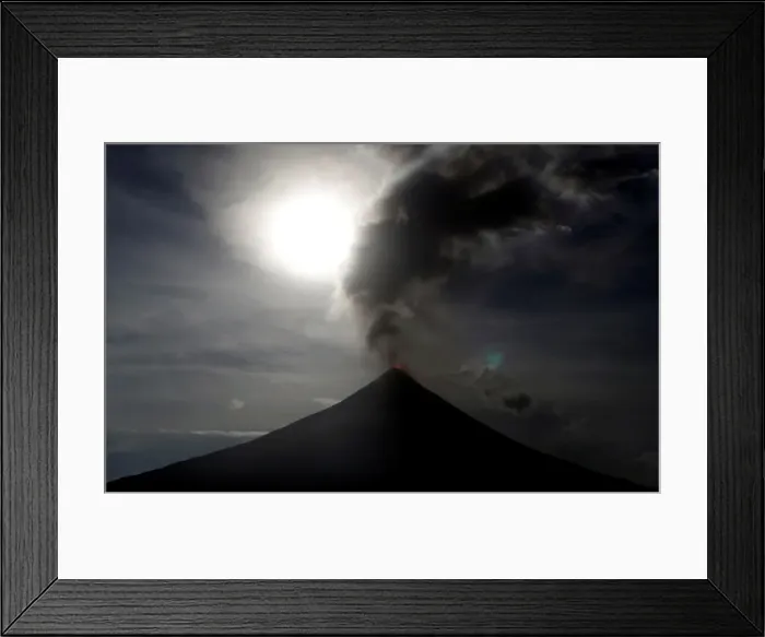 Framed Print : The super blue moon rises above the spewing Mayon Volcano during a mild eruption before a Framed Print : The super blue moon rises above the spewing Mayon Volcano during a mild eruption before a