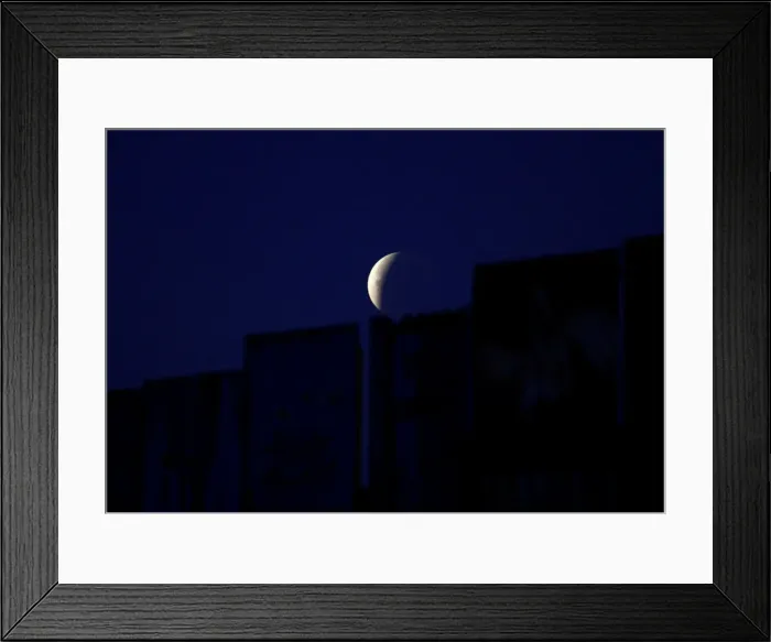 Framed Print : A Super Blue Blood Moon rises during a lunar eclipse in this picture taken from Framed Print : A Super Blue Blood Moon rises during a lunar eclipse in this picture taken from