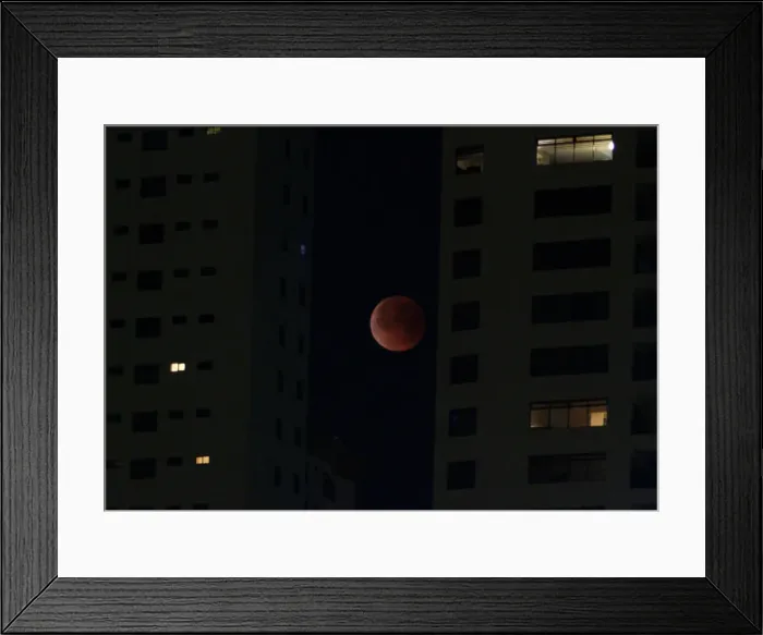 Framed Print : A Super Blue Blood Moon rises during a lunar eclipse in this picture taken from Framed Print : A Super Blue Blood Moon rises during a lunar eclipse in this picture taken from