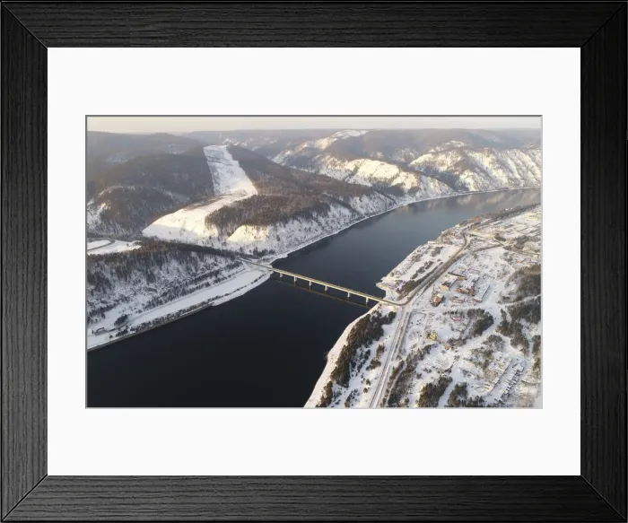 Framed Print : An aerial view shows a bridge of the R257 federal highway across the Yenisei River Framed Print : An aerial view shows a bridge of the R257 federal highway across the Yenisei River