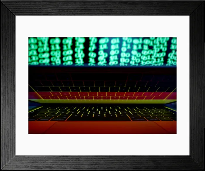 Framed Print : German flag is seen on the laptop screen in front of a computer screen on which cyber Framed Print : German flag is seen on the laptop screen in front of a computer screen on which cyber