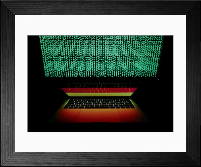 Framed Print : German flag is seen on the laptop screen in front of a computer screen on which cyber Framed Print : German flag is seen on the laptop screen in front of a computer screen on which cyber