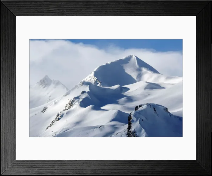 Framed Print : The snow sails to the top of a snowy mountain in Saint-Pancrace as winter weather Framed Print : The snow sails to the top of a snowy mountain in Saint-Pancrace as winter weather