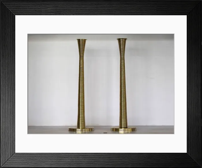 Framed Print : Silver plated candlesticks are seen for sale at an antique store in Islamabad Framed Print : Silver plated candlesticks are seen for sale at an antique store in Islamabad