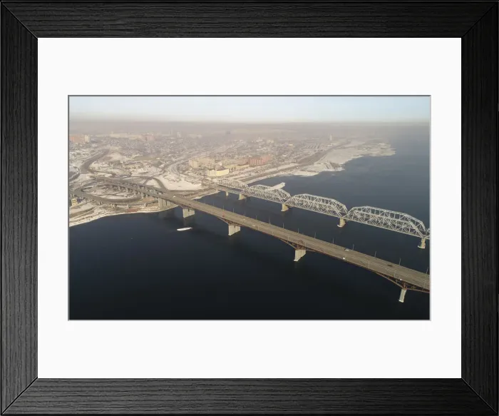 Framed Print : An aerial view shows the Nikolaevsky highway bridge and a bridge of the Trans-Siberian Framed Print : An aerial view shows the Nikolaevsky highway bridge and a bridge of the Trans-Siberian