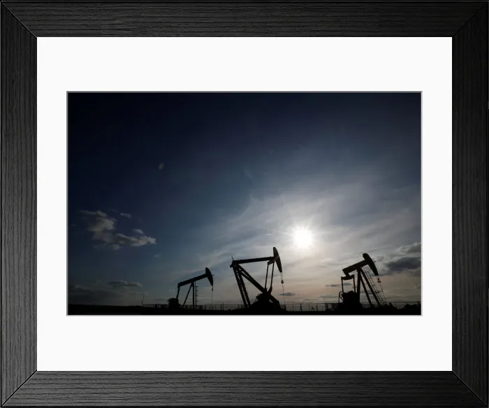 Framed Print : Oil pumps are seen at sunset outside Vaudoy-en-Brie Framed Print : Oil pumps are seen at sunset outside Vaudoy-en-Brie