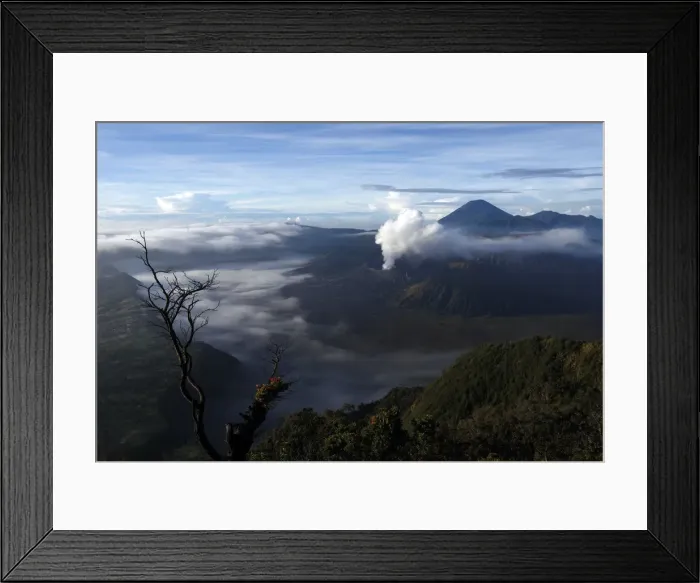 Framed Print : Indonesias Mount Bromo volcano spew smoke next to Mount Semeru volcano as seen Framed Print : Indonesias Mount Bromo volcano spew smoke next to Mount Semeru volcano as seen