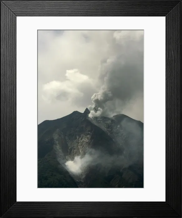 Framed Print : The Mount Sinabung volcano spews smoke in the district of Tanah Karo outside the city of